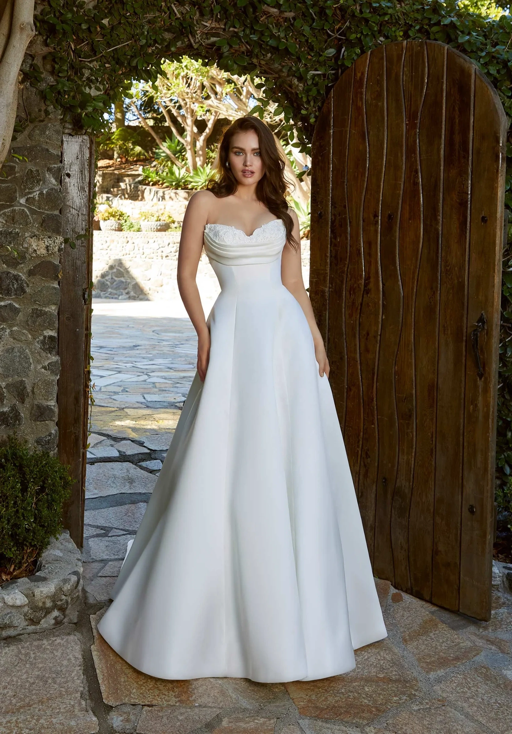 Model wearing a Morilee Blu dress